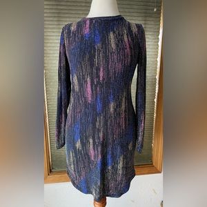 B. Darlin metallic blue, pink, gold, and black sparkly long sleeve dress